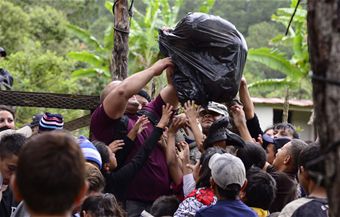 With the strength of their backs, Joint Task Force-Bravo delivers goods to Hondurans in need